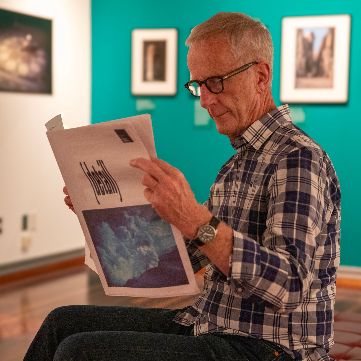 A copy of the Detail publication being read in an exhibition space.